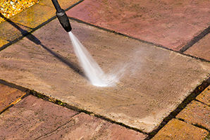 Patio slabs being cleaned with a jet washer