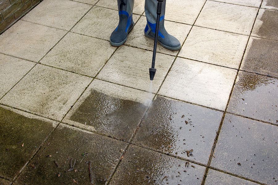 Clearing a blocked gutter and drain before winter